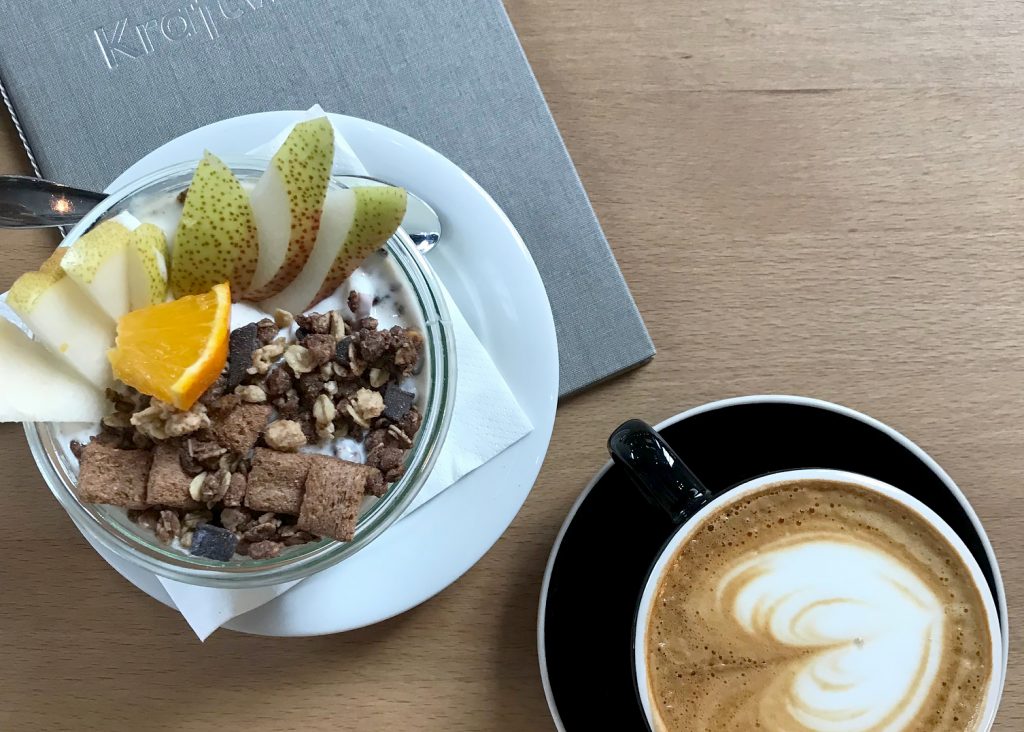 Coffee and granola on a table