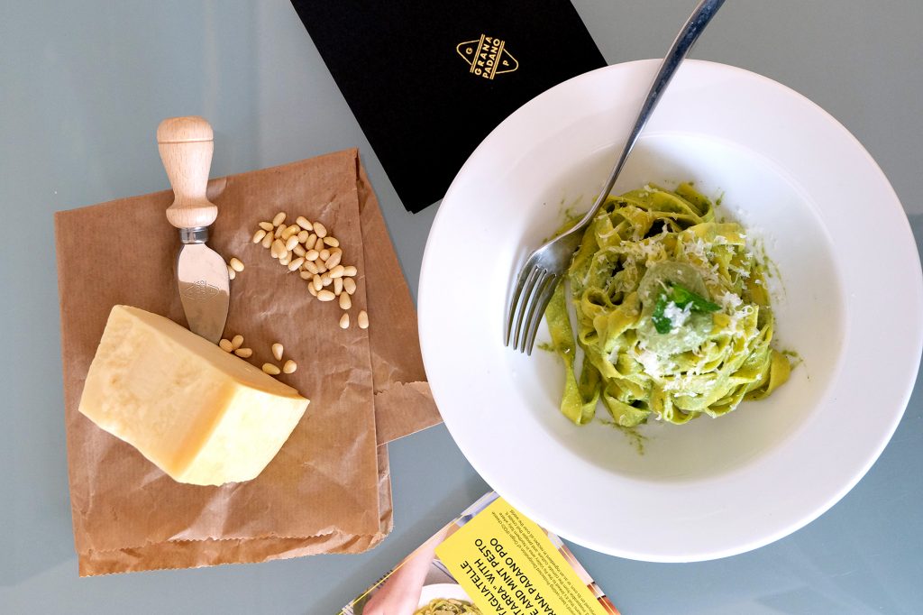 Top lay of a pasta plate with cheese to grate next to it