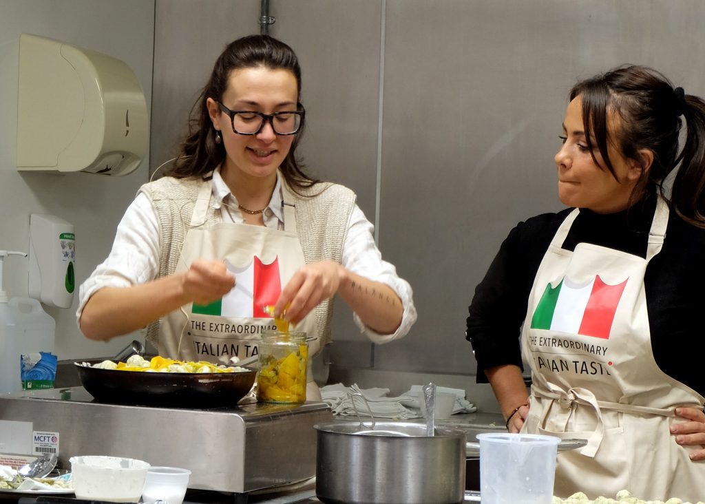 Two women cooks doing a demo