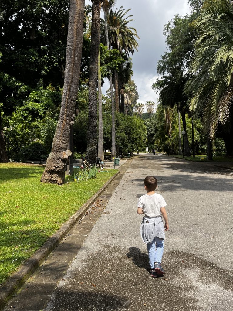 A child walking in Naples Botanical gardens